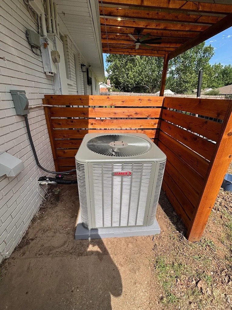 AC repair service in progress by a Cross Air technician